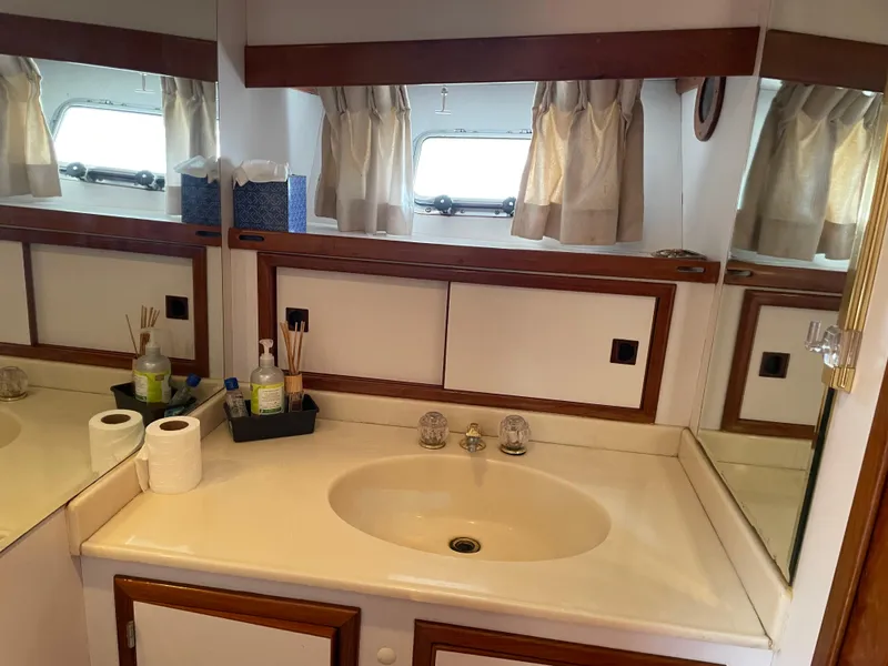 Slide: The Image of 1987 Lien Hwa yacht bathroom with sink, mirror, and toiletries. - 31