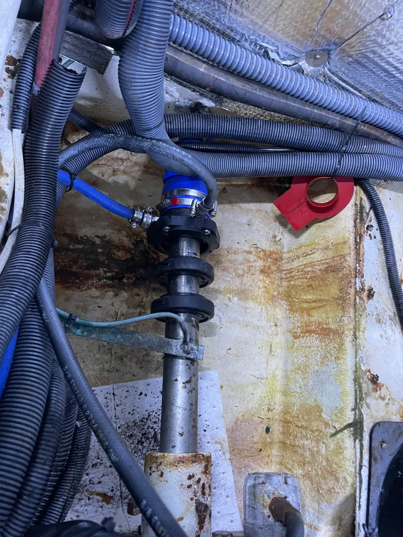 Slide: The Image of 1987 Lien Hwa 47' Mark III yacht engine compartment with visible wiring and components. - 48