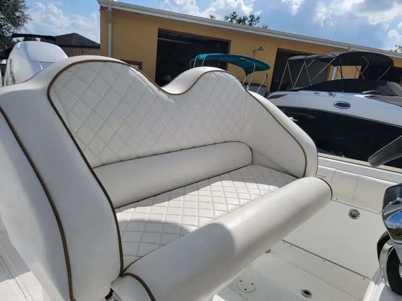 Slide: The Image of White quilted seat on 2018 Glasstream 328SCX boat, with sunny background. - 12