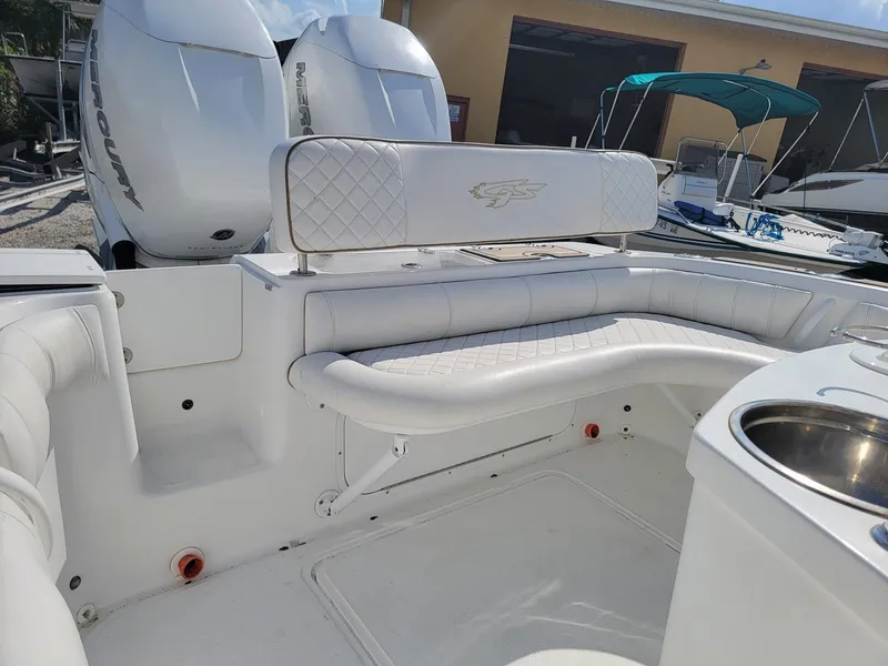 Slide: The Image of 2018 Glasstream 328SCX boat interior with white seating and dual Mercury engines. - 13