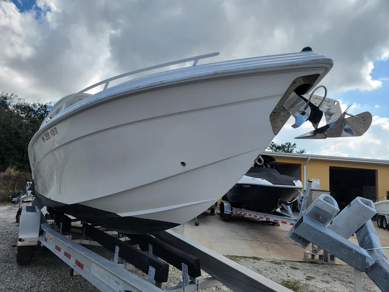 Slide: The Image of 2018 Glasstream 328SCX boat on trailer under cloudy sky. - 4