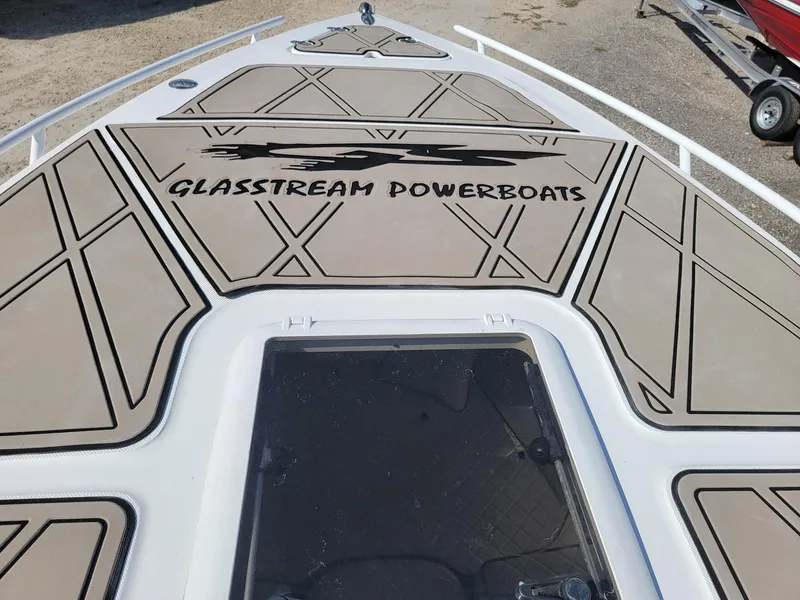 Slide: The Image of 2018 Glasstream 328SCX boat deck with logo and geometric design. - 9