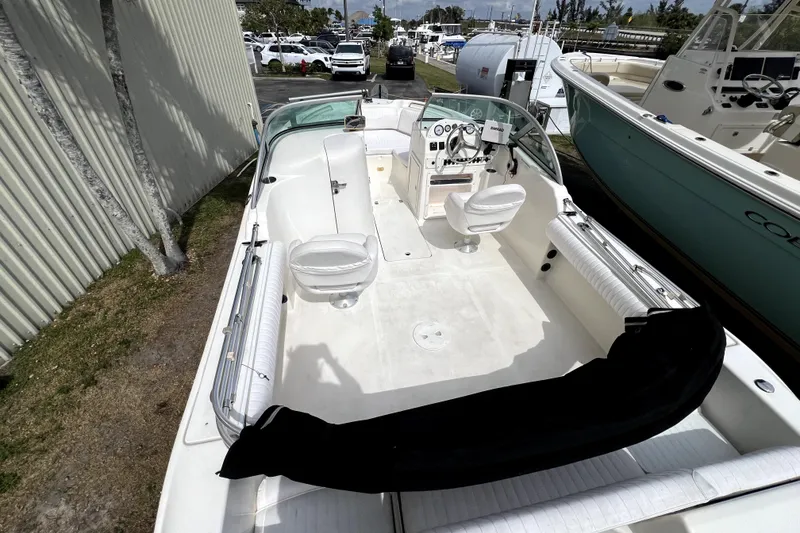 Slide: The Image of 2008 NauticStar 2000 DC Offshore boat interior with seating and steering console. - 13