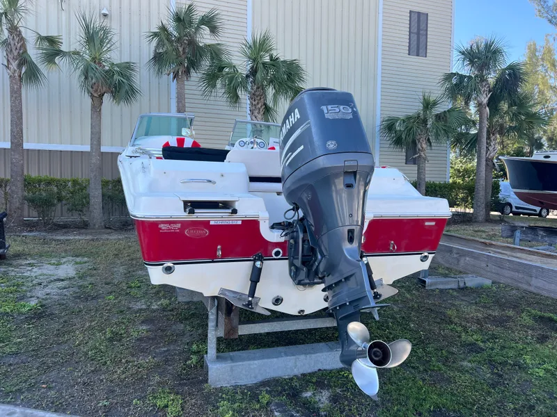 Slide: The Image of 2008 NauticStar 2000 DC Offshore boat with Yamaha 150 outboard motor, docked outdoors. - 2