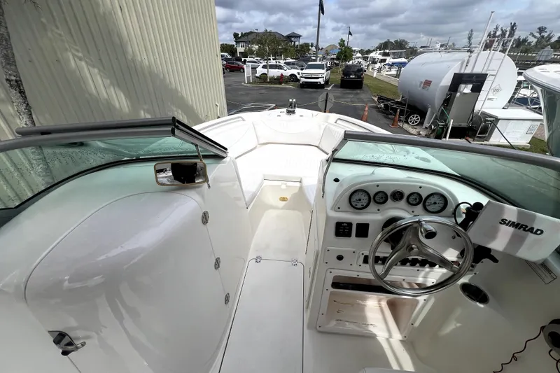 Slide: The Image of 2008 NauticStar 2000 DC Offshore boat interior with steering wheel and dashboard controls. - 7