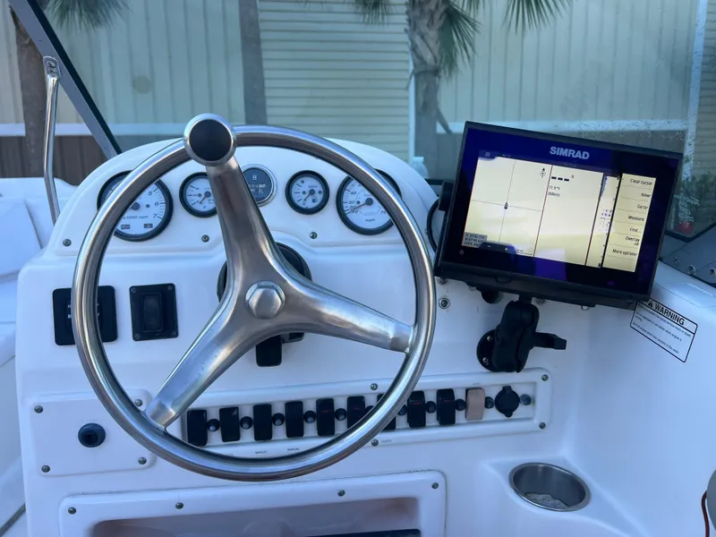 Slide: The Image of Steering console of 2008 NauticStar 2000 DC boat with Simrad navigation display. - 8
