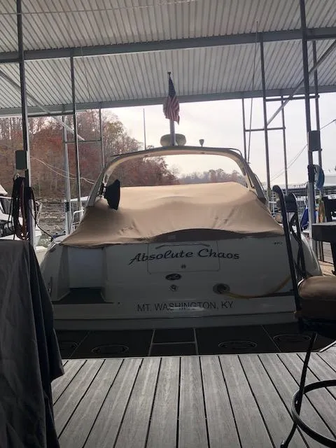 Slide: The Image of 2001 Sea Ray 410 Sundancer docked, covered, with "Absolute Chaos" name, Mt. Washington, KY. - 18