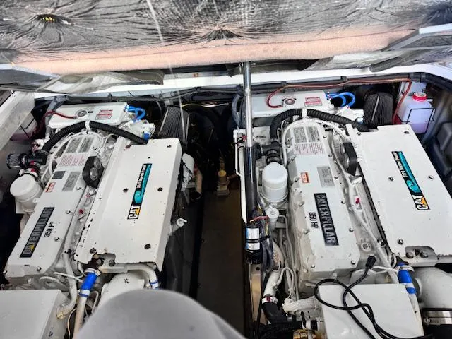 Slide: The Image of Engine room of 2001 Sea Ray 410 Sundancer with dual Caterpillar engines. - 24