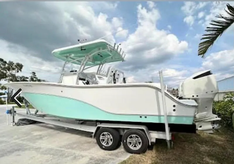 The Image of 2015 Sea Fox 286 Commander boat on trailer under cloudy sky. - 0