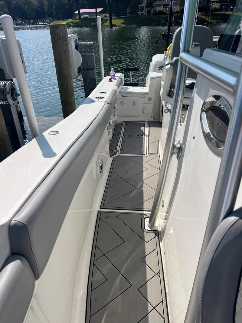 Slide: The Image of 2015 Sea Fox 286 Commander boat deck with sleek design and waterfront view. - 11