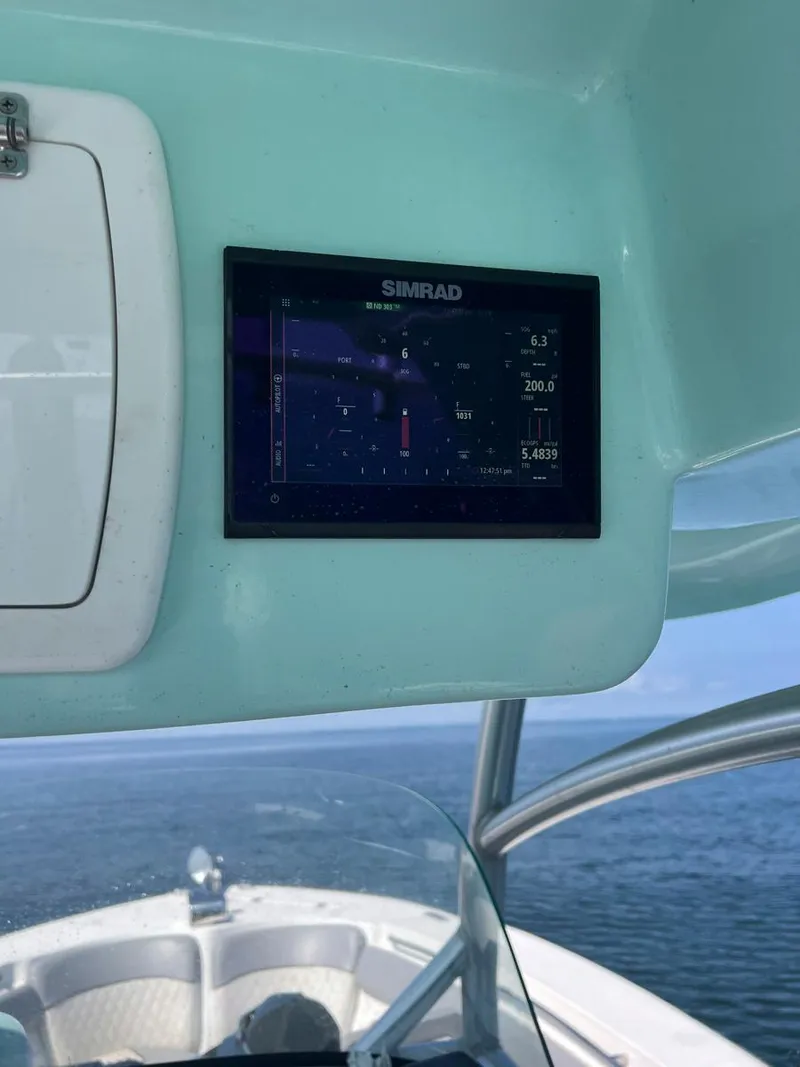 Slide: The Image of Simrad display on 2015 Sea Fox 286 Commander boat, showing navigation data. - 12
