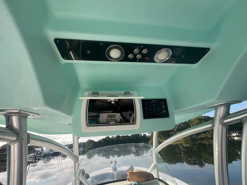 Slide: The Image of 2015 Sea Fox 286 Commander boat console with electronics and storage compartment. - 13