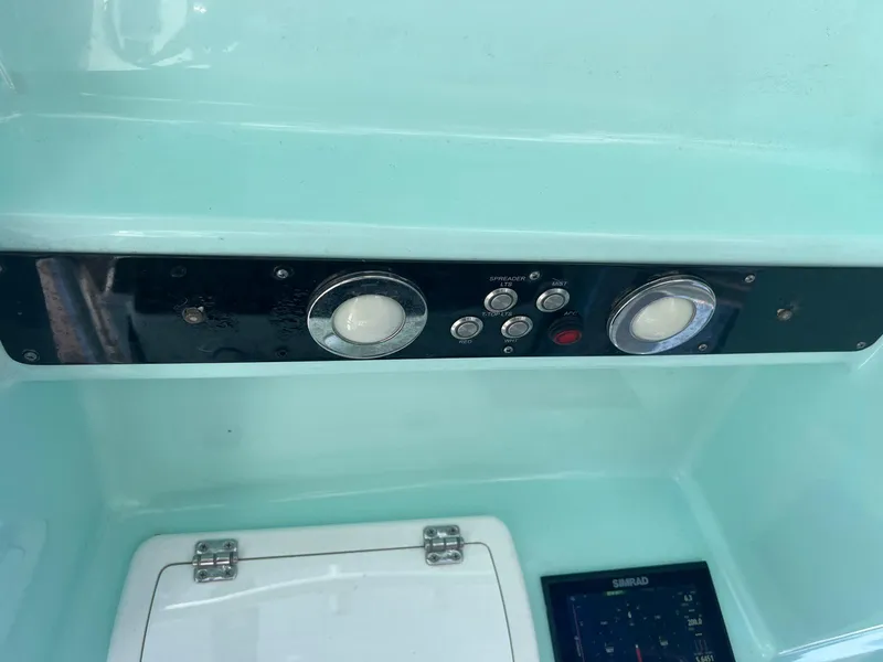 Slide: The Image of Control panel of a 2015 Sea Fox 286 Commander boat, featuring gauges and switches. - 16