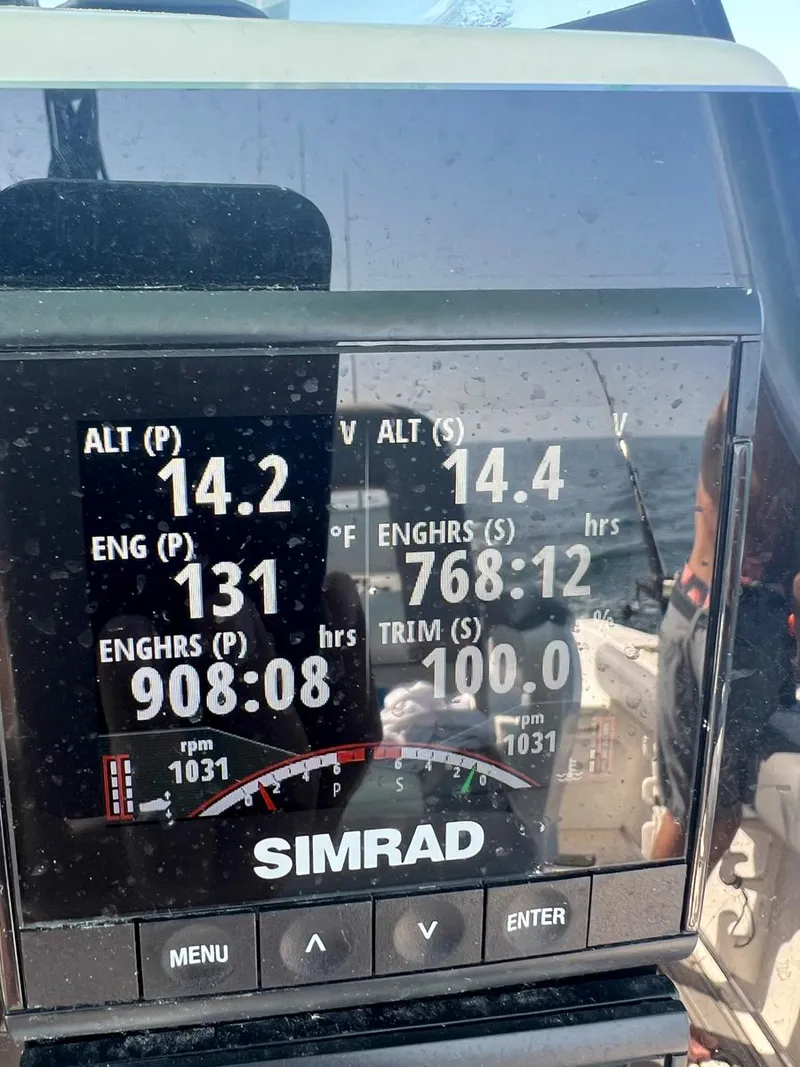 Slide: The Image of Simrad display on 2015 Sea Fox 286 Commander showing engine hours and RPM. - 17