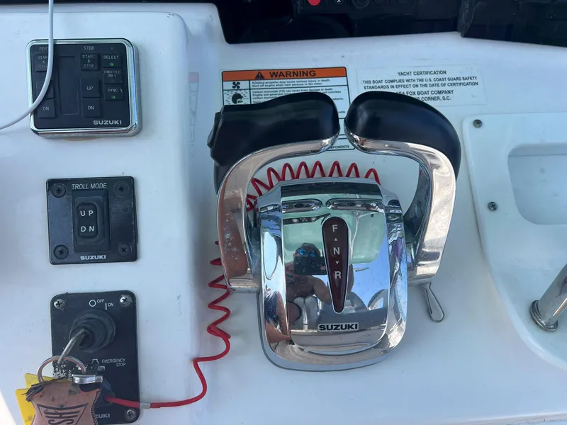 Slide: The Image of Control panel of a 2015 Sea Fox 286 Commander boat with Suzuki throttle. - 3