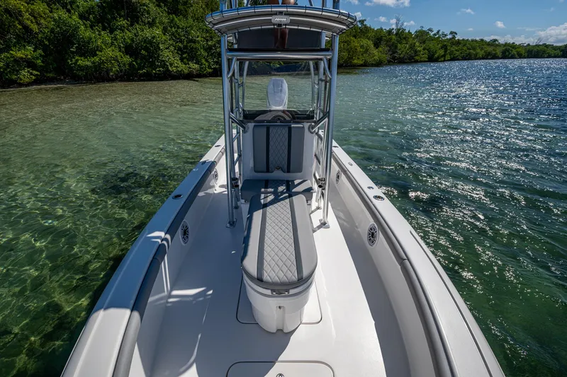 Slide: The Image of 2023 Lake & Bay Backwater boat on clear water near lush shoreline. - 40