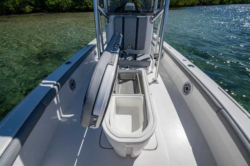 Slide: The Image of 2023 Lake & Bay Backwater boat interior with open storage compartment on clear water. - 45