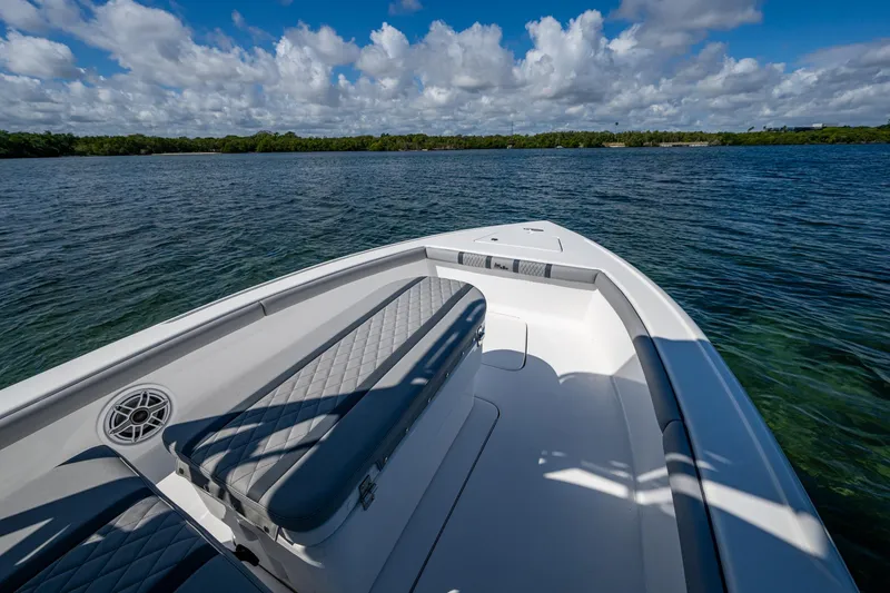 Slide: The Image of 2023 Lake & Bay Backwater boat on calm water under a cloudy sky. - 47