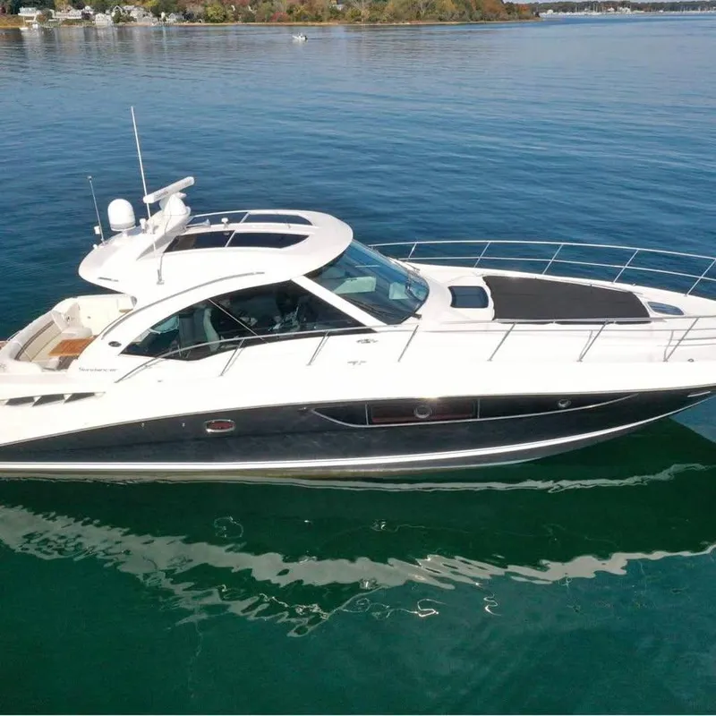 Slide: The Image of 2012 Sea Ray 500 Sundancer yacht on calm water, side view. - 0