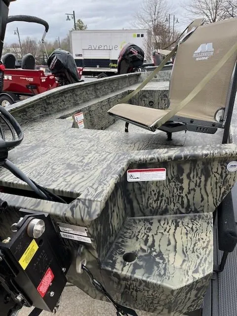 Slide: The Image of 2025 Tracker Grizzly 1650 T Prairie Wings Edition boat with camouflage design and seating. - 3