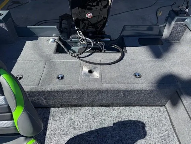 Slide: The Image of 2025 Ranger VS1882SC Angler boat interior with motor and seating area. - 10