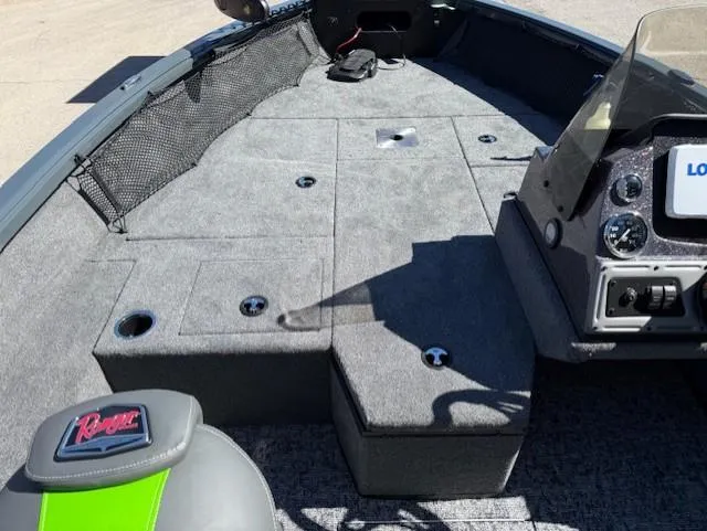 Slide: The Image of 2025 Ranger VS1882SC Angler boat interior with gray carpet and seating. - 13
