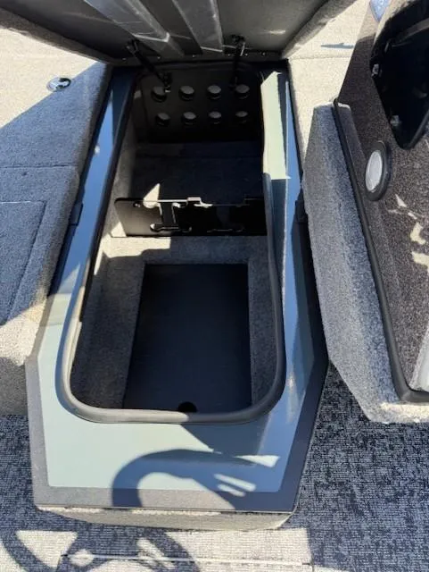 Slide: The Image of 2025 Ranger VS1882SC Angler boat storage compartment with open lid, showcasing interior space. - 14