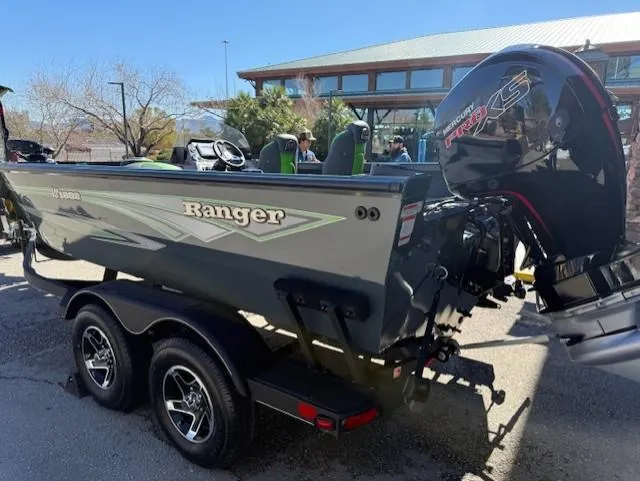 Slide: The Image of 2025 Ranger VS1882SC Angler boat with powerful outboard motor, parked outdoors. - 6