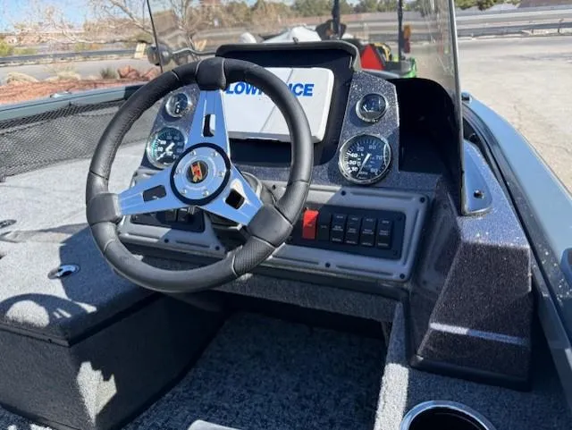 Slide: The Image of 2025 Ranger VS1882SC Angler boat dashboard with steering wheel and control panel. - 7
