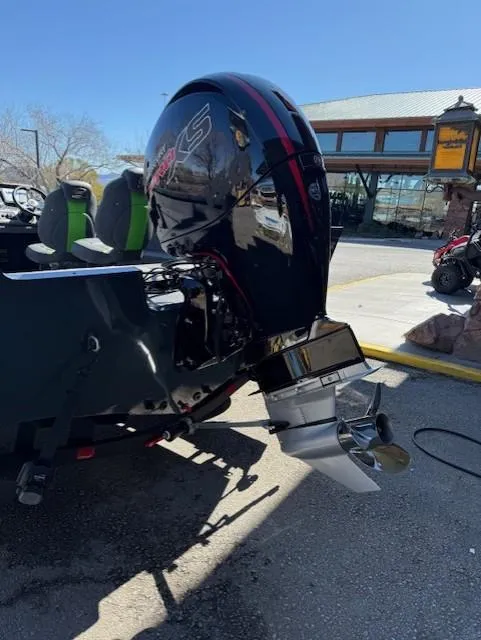 Slide: The Image of 2025 Ranger VS1882SC Angler boat with powerful outboard motor, parked outdoors. - 9