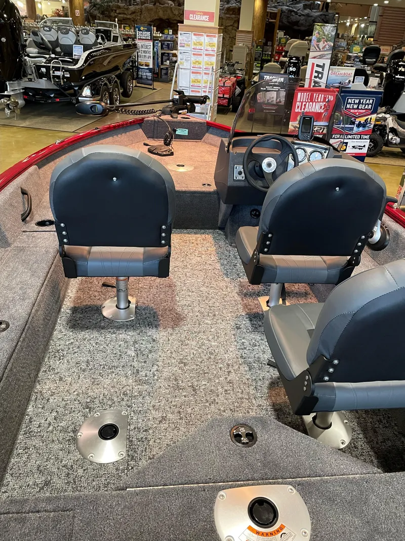 Slide: The Image of 2025 Tracker Pro Guide V-16 SC boat interior with seating and steering console. - 3