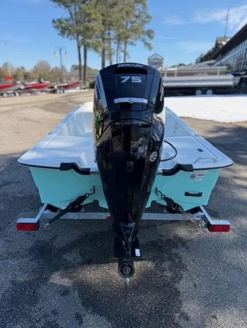 Slide: The Image of 2025 Mako Pro Skiff 17 CC with Mercury 75 engine, parked outdoors. - 47