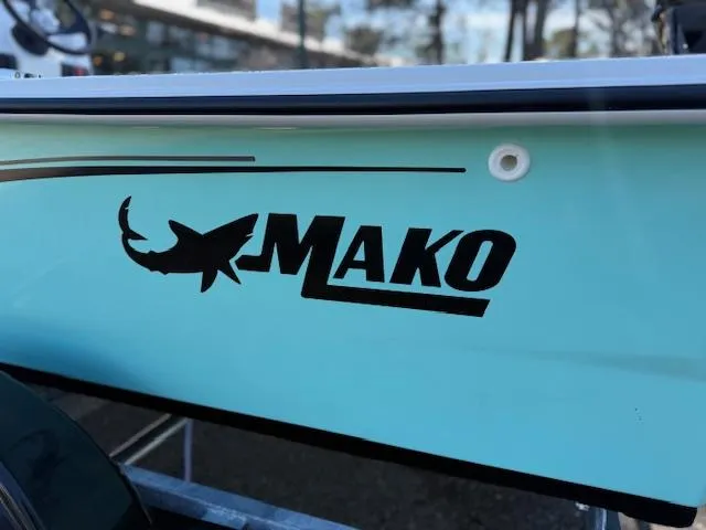 Slide: The Image of 2025 Mako Pro Skiff 17 CC boat logo on light blue hull. - 48
