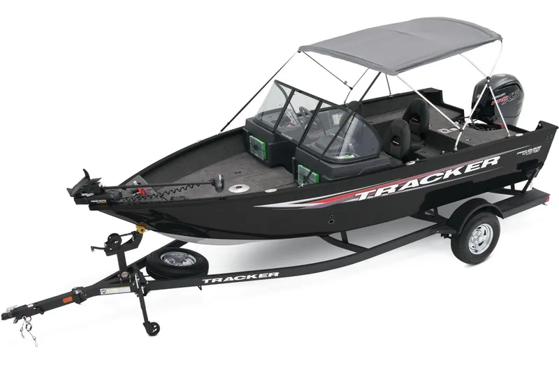 Slide: The Image of 2025 Tracker Pro Guide V-175 WT boat with 150 HP engine, parked outdoors. - 5