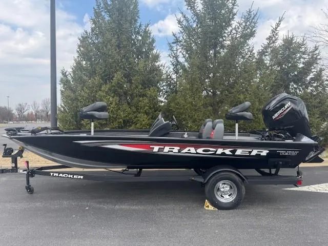 The Image of 2025 Tracker Pro Team 190 boat on trailer, parked outdoors. - 0