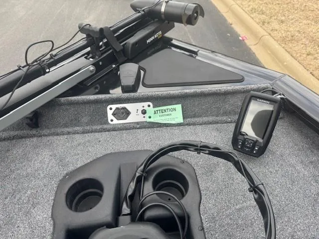 Slide: The Image of 2025 Tracker Pro Team 190 boat interior with fish finder and trolling motor. - 4