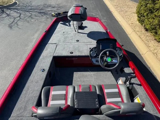 Slide: The Image of 2025 Ranger RT178C boat interior with red accents and modern dashboard. - 2