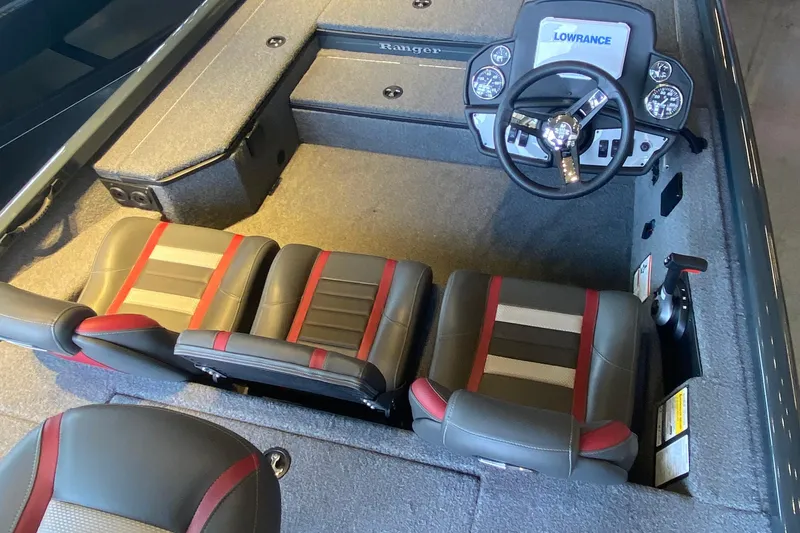 Slide: The Image of 2025 Ranger RT178 boat interior with steering wheel, Lowrance system, and stylish seating. - 3