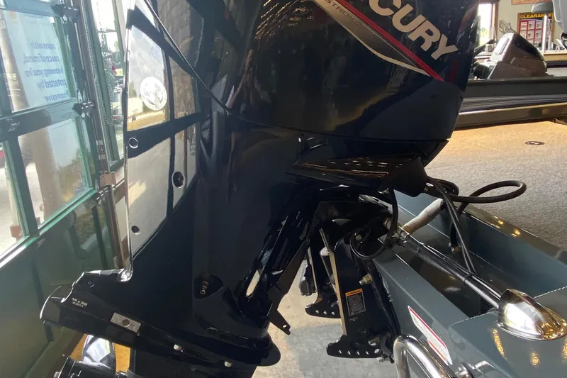 Slide: The Image of 2025 Ranger RT178 boat with Mercury outboard motor in showroom. - 5