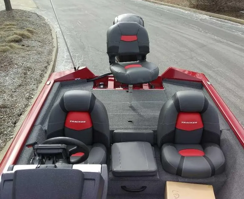Slide: The Image of 2025 Tracker Pro Team 175 boat interior with red and black seating. - 3