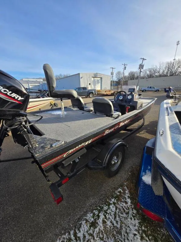 Slide: The Image of 2022 Tracker Bass Tracker Classic XL boat with Mercury engine, parked outdoors. - 11