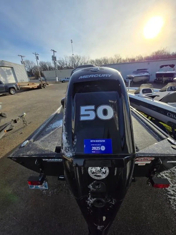 Slide: The Image of 2022 Tracker Bass Tracker Classic XL with Mercury 50 engine in a parking lot. - 12