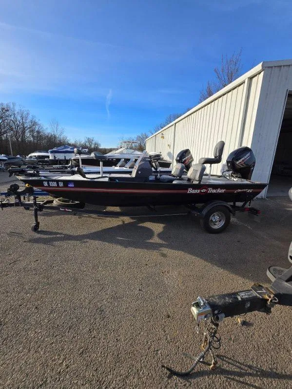 Slide: The Image of 2022 Tracker Bass Tracker Classic XL boat parked outside a storage facility. - 13