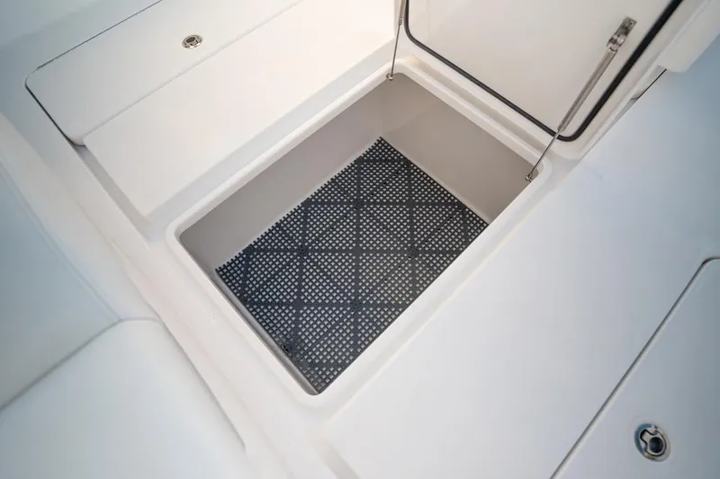 Slide: The Image of Storage compartment on 2020 Invincible 36 CC boat with non-slip mat. - 19