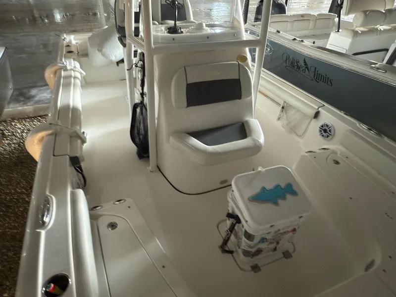 Slide: The Image of 2020 Tidewater 2300 Carolina Bay boat interior with seating and cooler. - 10