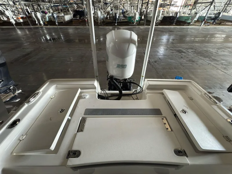 Slide: The Image of 2020 Tidewater 2300 Carolina Bay boat with outboard motor in storage facility. - 14