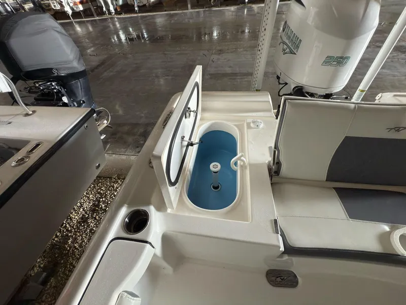 Slide: The Image of 2020 Tidewater 2300 Carolina Bay boat with open livewell in a storage facility. - 15