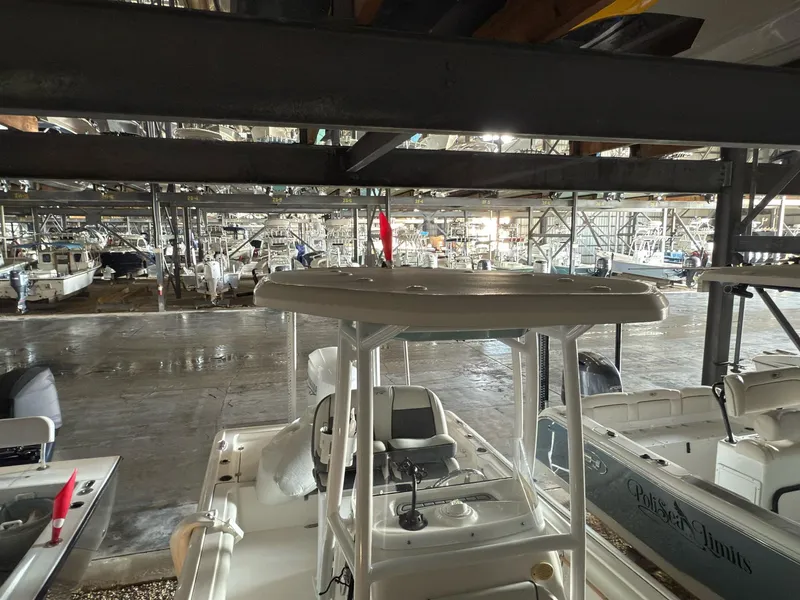 Slide: The Image of 2020 Tidewater 2300 Carolina Bay boat in indoor storage facility. - 16