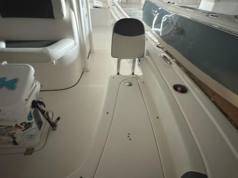 Slide: The Image of 2020 Tidewater 2300 Carolina Bay interior with seating and storage. - 17