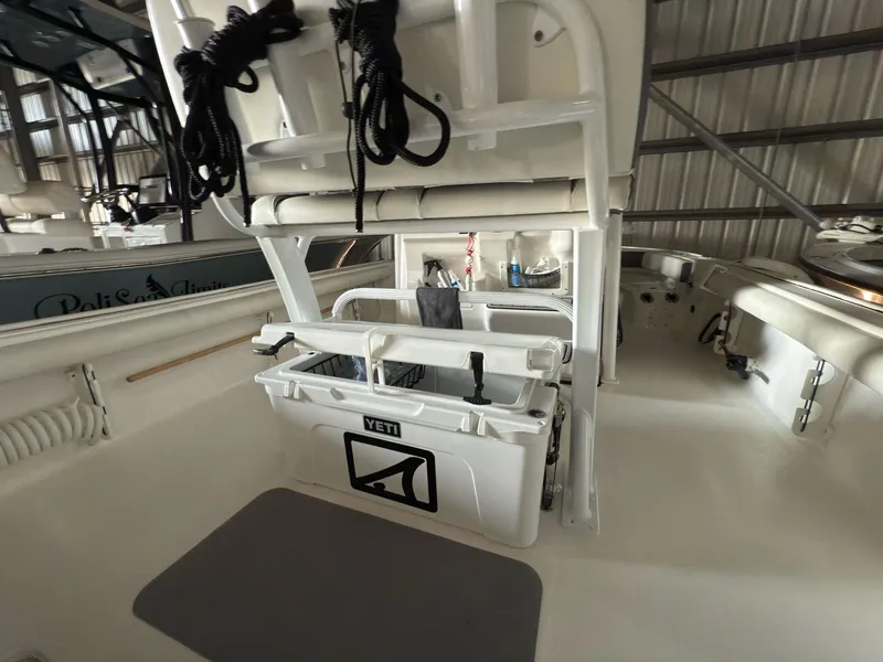 Slide: The Image of 2020 Tidewater 2300 Carolina Bay boat interior with Yeti cooler and storage. - 20